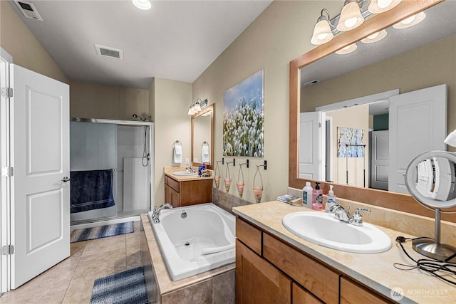 9159 Riverview Way NW Unit D39, Quincy, WA 98848 - full bathroom featuring a shower stall, two vanities, a garden tub, and tile patterned floors