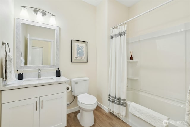 121 120th St SE Unit B, Everett, WA 98208 - bathroom featuring wood finished floors, vanity, and shower / bath combo with shower curtain