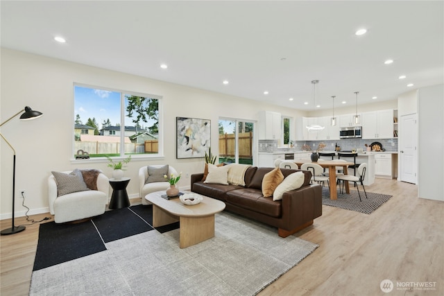121 120th St SE Unit B, Everett, WA 98208 - living room featuring light wood-type flooring and recessed lighting