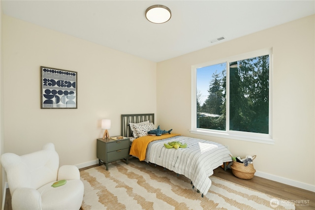 121 120th St SE Unit B, Everett, WA 98208 - bedroom featuring baseboards and wood finished floors