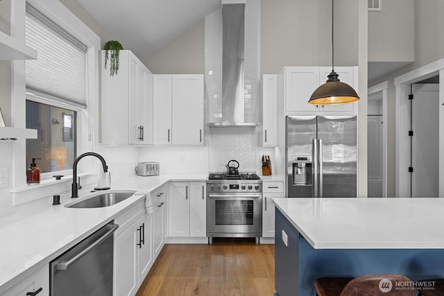 141 Panorama Dr, Cle Elum, WA 98922 - kitchen featuring stainless steel appliances, a sink, wall chimney exhaust hood, decorative backsplash, and white cabinetry