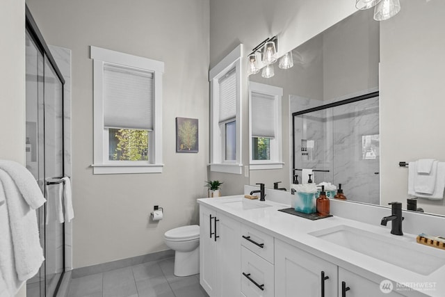 141 Panorama Dr, Cle Elum, WA 98922 - full bathroom with toilet, a marble finish shower, double vanity, tile patterned flooring, and baseboards