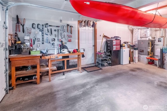 22 Inlet Cir, Bellingham, WA 98229 - garage featuring a workshop area and strapped water heater