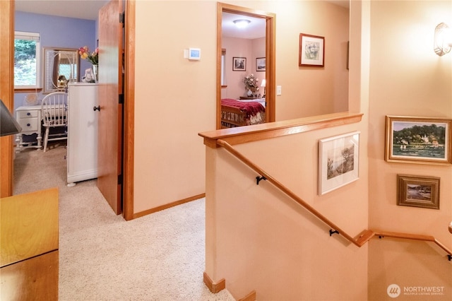 22 Inlet Cir, Bellingham, WA 98229 - hall with an upstairs landing, light carpet, and baseboards