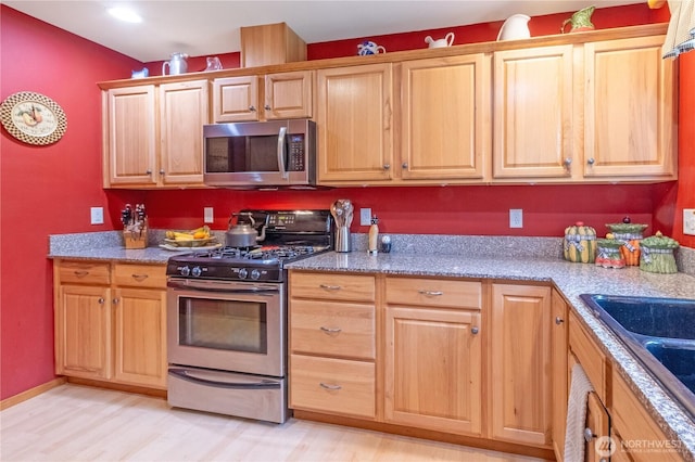 22 Inlet Cir, Bellingham, WA 98229 - kitchen featuring stainless steel appliances, a sink, light wood-style floors, and stone counters