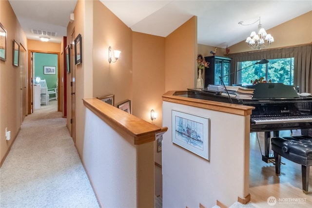22 Inlet Cir, Bellingham, WA 98229 - hall with an upstairs landing, a chandelier, lofted ceiling, and carpet flooring