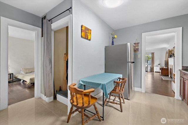 220 W Willis St, Kent, WA 98032 - dining room featuring light tile patterned floors and baseboards
