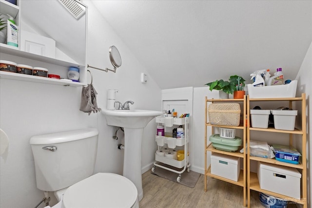 220 W Willis St, Kent, WA 98032 - bathroom featuring lofted ceiling, wood finished floors, and toilet