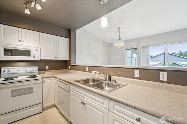 15150 140th Way SE Unit T304, Renton, WA 98058 - kitchen featuring white appliances, a sink, white cabinetry, a chandelier, and light countertops