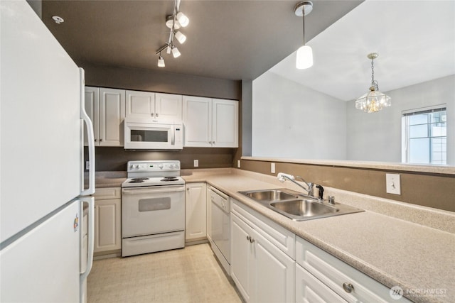 15150 140th Way SE Unit T304, Renton, WA 98058 - kitchen with white appliances, a sink, white cabinets, decorative light fixtures, and light countertops