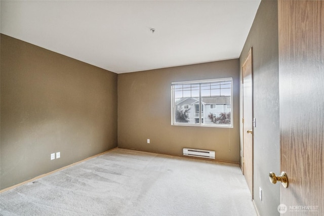 15150 140th Way SE Unit T304, Renton, WA 98058 - empty room with a baseboard heating unit, light colored carpet, fire sprinkler in ceiling, and baseboards