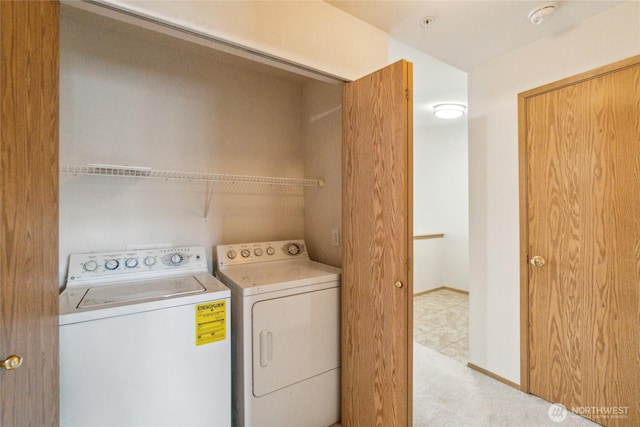 15150 140th Way SE Unit T304, Renton, WA 98058 - laundry room with washer and dryer, carpet, and baseboards