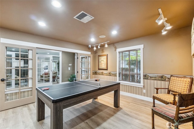15150 140th Way SE Unit T304, Renton, WA 98058 - recreation room with light wood-type flooring, wainscoting, recessed lighting, french doors, and baseboards