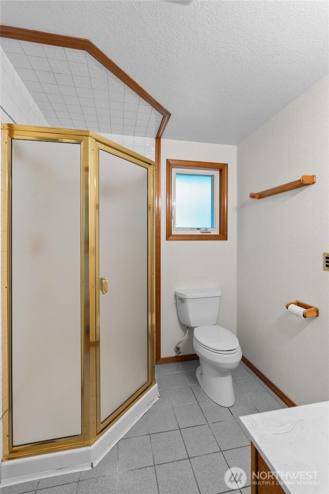 4205 Delphi Rd SW, Olympia, WA 98512 - bathroom featuring vanity, a stall shower, toilet, a textured ceiling, and baseboards