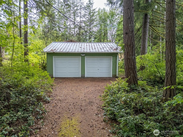 4205 Delphi Rd SW, Olympia, WA 98512 - detached garage featuring a view of trees and dirt driveway