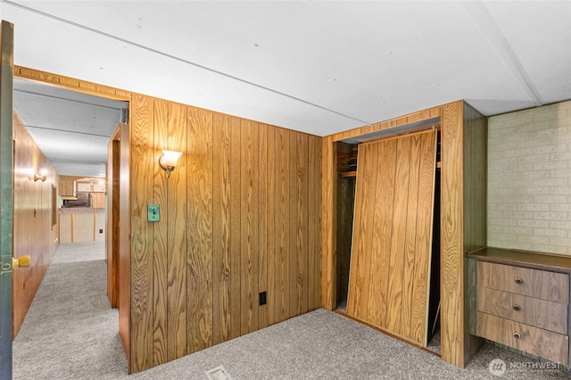 4205 Delphi Rd SW, Olympia, WA 98512 - unfurnished bedroom with wood walls, carpet, and a closet
