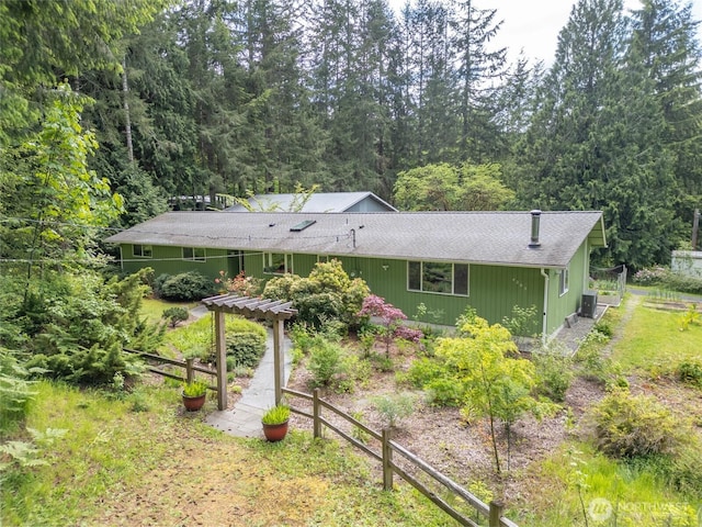 4205 Delphi Rd SW, Olympia, WA 98512 - view of front of house featuring a shingled roof, a pergola, and a view of trees