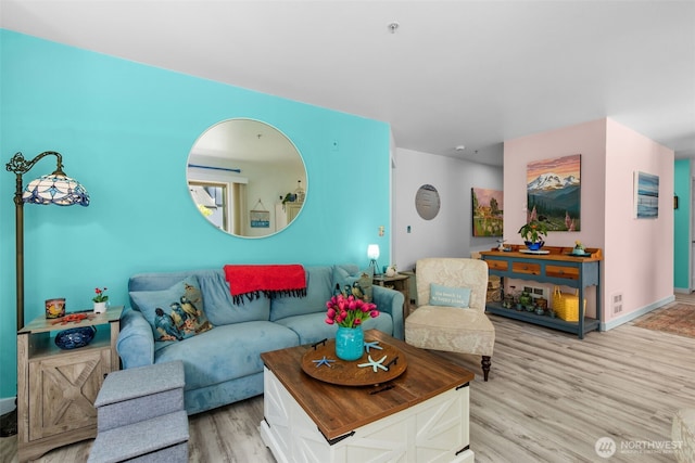 20800 72nd Ave W Unit 202, Edmonds, WA 98026 - living area featuring light wood-style floors and baseboards