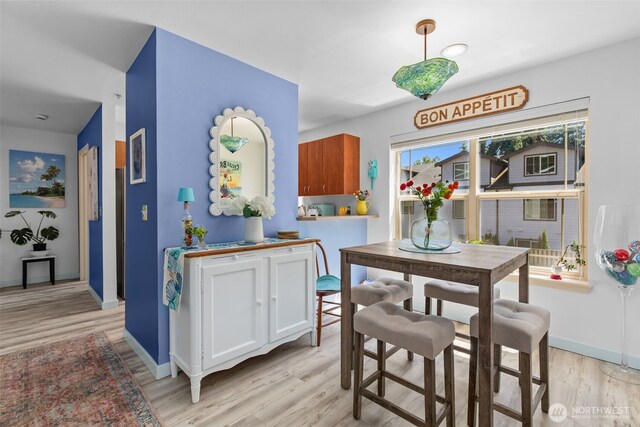 20800 72nd Ave W Unit 202, Edmonds, WA 98026 - dining space featuring light wood-type flooring and baseboards