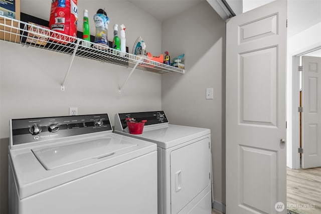 20800 72nd Ave W Unit 202, Edmonds, WA 98026 - washroom featuring washing machine and dryer and light wood-type flooring