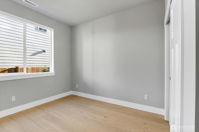 8010 222nd St SW, Edmonds, WA 98026 - unfurnished room with healthy amount of natural light, wood finished floors, and baseboards