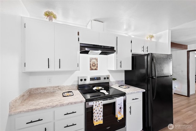 22412 110th Ave SE, Kent, WA 98031 - kitchen with stainless steel electric range oven, under cabinet range hood, freestanding refrigerator, light wood finished floors, and light countertops
