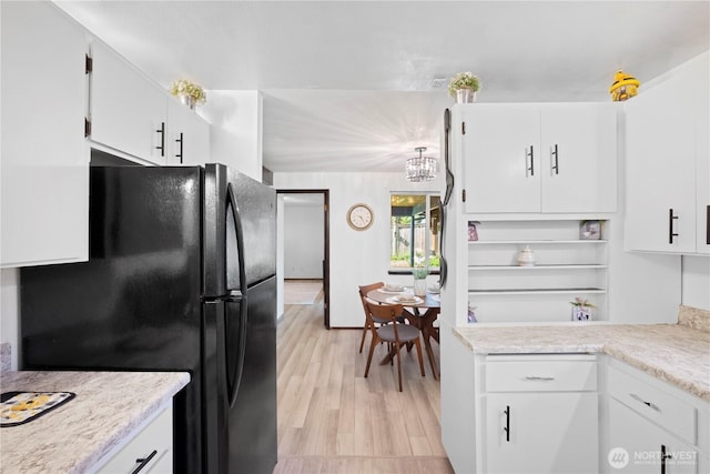 22412 110th Ave SE, Kent, WA 98031 - kitchen with freestanding refrigerator, light countertops, white cabinets, and light wood-type flooring