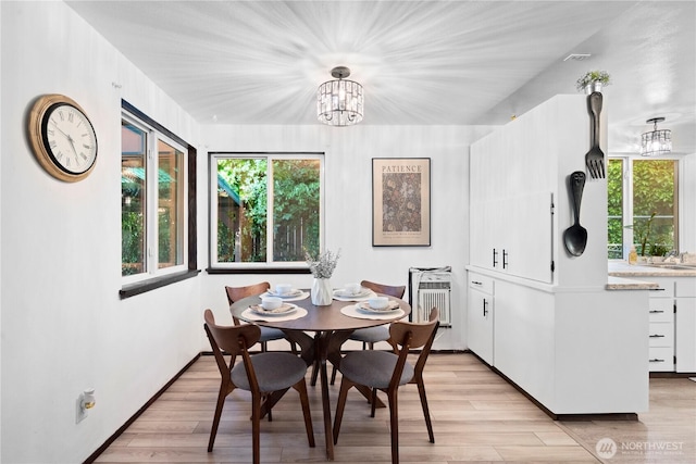 22412 110th Ave SE, Kent, WA 98031 - dining room featuring a chandelier, light wood-type flooring, and plenty of natural light