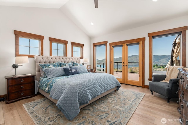 653 Lakayuse Rd, Manson, WA 98831 - bedroom with access to outside, french doors, light wood-style floors, high vaulted ceiling, and a mountain view