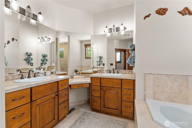 653 Lakayuse Rd, Manson, WA 98831 - full bath featuring two vanities, a garden tub, and tile patterned floors