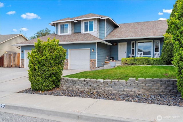 2562 Fancher Heights Blvd, East Wenatchee, WA 98802 - view of front of home with stone siding, driveway, roof with shingles, and an attached garage