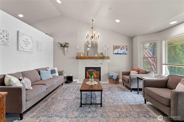 2562 Fancher Heights Blvd, East Wenatchee, WA 98802 - living room featuring vaulted ceiling, a chandelier, recessed lighting, a lit fireplace, and baseboards