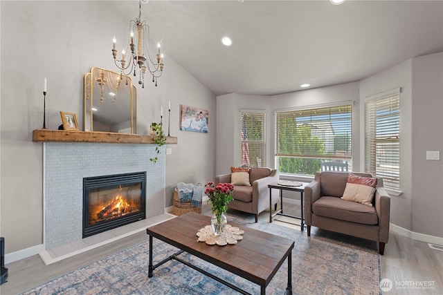 2562 Fancher Heights Blvd, East Wenatchee, WA 98802 - living room featuring wood finished floors, a fireplace, baseboards, a chandelier, and recessed lighting