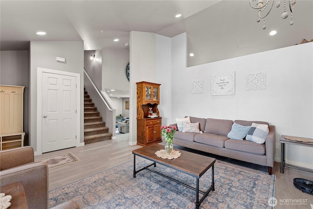 2562 Fancher Heights Blvd, East Wenatchee, WA 98802 - living area featuring wood finished floors, stairway, high vaulted ceiling, recessed lighting, and baseboards