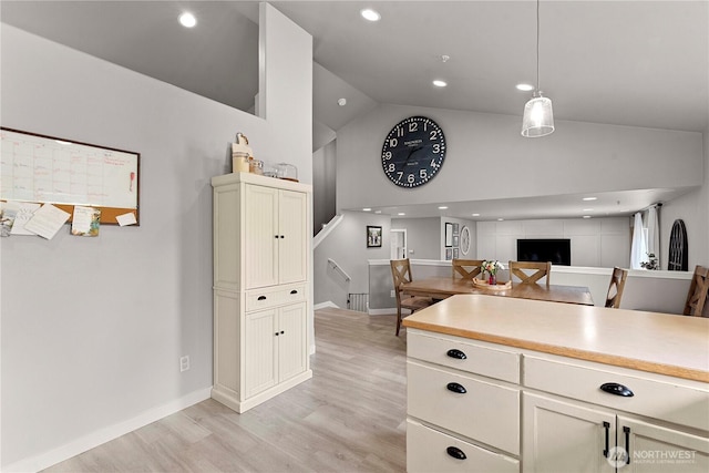 2562 Fancher Heights Blvd, East Wenatchee, WA 98802 - kitchen with high vaulted ceiling, light wood-style flooring, light countertops, baseboards, and recessed lighting