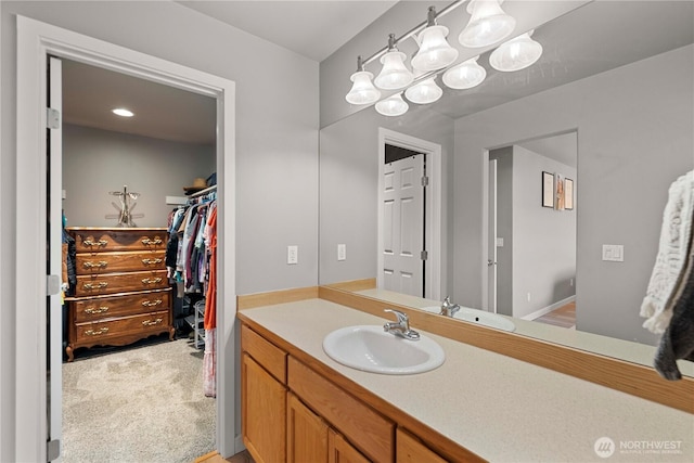 2562 Fancher Heights Blvd, East Wenatchee, WA 98802 - bathroom featuring vanity and a walk in closet