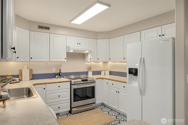 24390 Mount Washington View Ln NW, Poulsbo, WA 98370 - kitchen with white fridge with ice dispenser, stainless steel electric range, under cabinet range hood, a sink, and white cabinetry