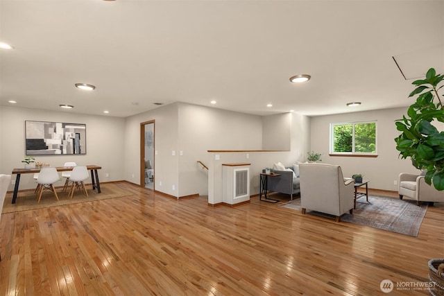 24390 Mount Washington View Ln NW, Poulsbo, WA 98370 - living area featuring wood-type flooring, baseboards, and recessed lighting