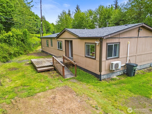 323 Pacific Hwy, Bellingham, WA 98229 - manufactured / mobile home with a wooden deck, ac unit, and a shingled roof