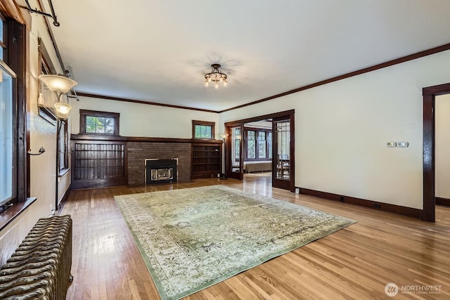 625 5th Ave S, Kent, WA 98032 - living room featuring plenty of natural light, wood finished floors, radiator heating unit, a fireplace, and ornamental molding
