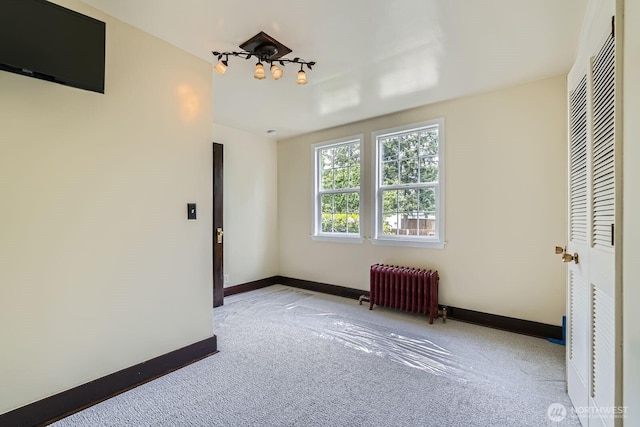 625 5th Ave S, Kent, WA 98032 - unfurnished bedroom featuring radiator heating unit, carpet floors, and baseboards