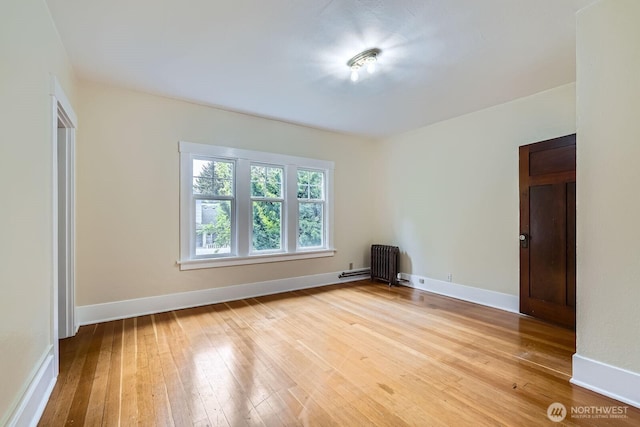 625 5th Ave S, Kent, WA 98032 - spare room with light wood-style floors, radiator, and baseboards