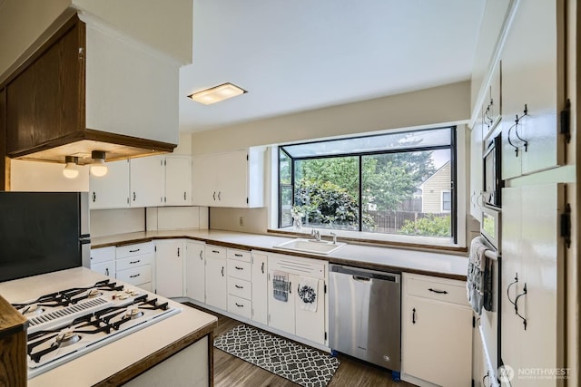 625 5th Ave S, Kent, WA 98032 - kitchen with appliances with stainless steel finishes, a sink, dark wood-type flooring, and white cabinets