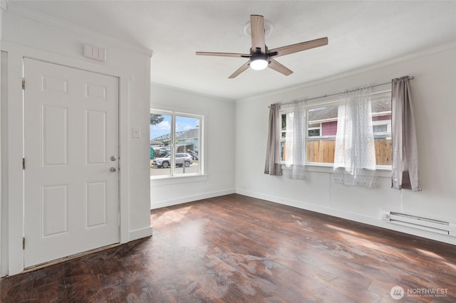 325 NW 2nd Ave, Kelso, WA 98626 - unfurnished room with ceiling fan, baseboards, dark wood-style floors, crown molding, and a baseboard heating unit