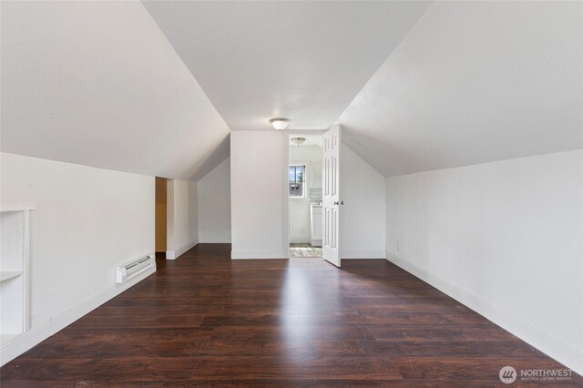 325 NW 2nd Ave, Kelso, WA 98626 - additional living space featuring a baseboard heating unit, wood finished floors, lofted ceiling, and baseboards