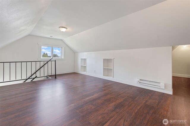 325 NW 2nd Ave, Kelso, WA 98626 - bonus room featuring a baseboard heating unit, built in shelves, wood finished floors, lofted ceiling, and baseboards