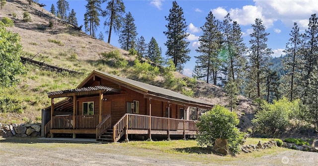 9460 Eagle Creek Rd, Leavenworth, WA 98826 - view of front of house featuring metal roof and a porch