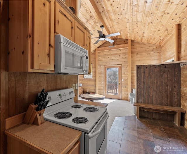 9460 Eagle Creek Rd, Leavenworth, WA 98826 - kitchen featuring white appliances, wooden walls, a ceiling fan, wooden ceiling, and vaulted ceiling