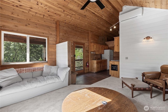 9460 Eagle Creek Rd, Leavenworth, WA 98826 - living area with lofted ceiling, wooden walls, ceiling fan, a wall mounted AC, and dark carpet