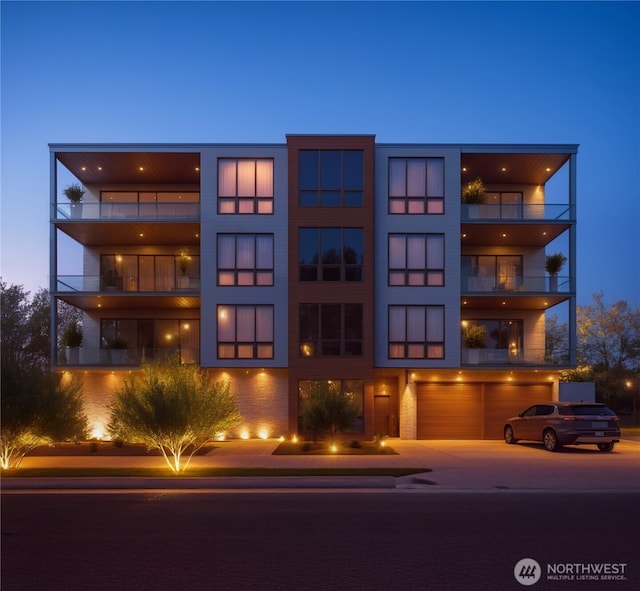 238 4th Ave Unit 101, Kirkland, WA 98033 - view of property with a garage and concrete driveway